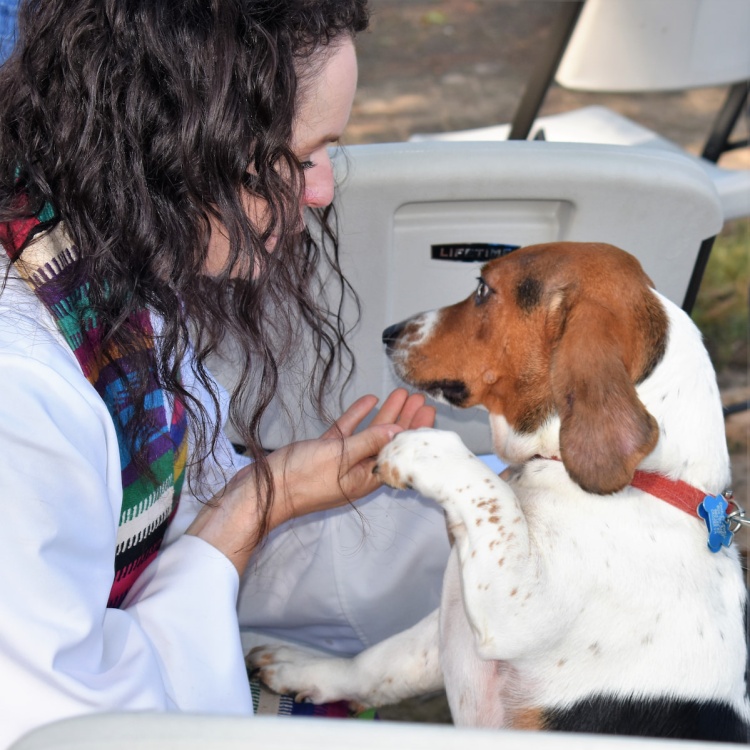 Emily blessing dog